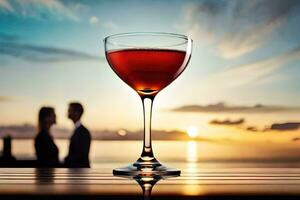 a glass of red wine on a table in front of a sunset. AI-Generated photo