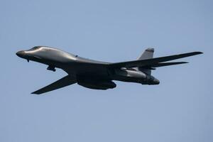 Strategic bomber plane at air base. Air force and army. Airport and airfield. Military aircraft. Aviation industry. photo