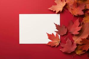 Layout of a white card in red autumn leaves on the table. AI Generated photo