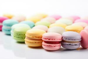 Multicolored macaroons spread out on a white table. AI Generated photo