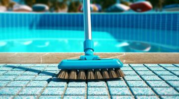 A close-up shot of professional pool cleaning tool, pool brush, neatly arranged by the side of the pool, emphasizing the importance of pool maintenance and cleanliness. photo