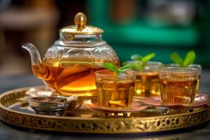 Traditional Moroccan tea set with decorative teapot, glasses, and mint leaves, showcasing the artistry and hospitality of Moroccan tea culture. Generative AI photo