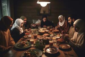 A group of people breaking their fast together. A table full of traditional Ramadan foods in the foreground. Joy and togetherness of the occasion, with the people shown smiling. Generative AI photo