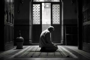 un hombre Orando a un mezquita. hombre s devoción como él reza el mezquita ser mostrado en el antecedentes a énfasis en el espiritual aspecto de Ramadán. generativo ai. foto