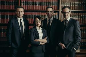 Advertising portrait shot of a lawyers team standing together in a court and they look at the camera. Generative AI. photo