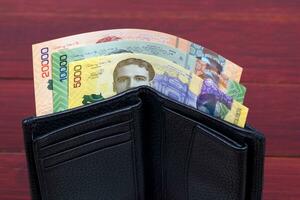 Costa Rican money in the black wallet photo