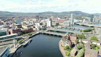 Aerial view on river and buildings in City centre of Belfast Northern Ireland. Drone photo, high angle view of town video