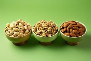 Nut trio in ceramic bowl on green backdrop, promoting healthy eating AI Generated photo