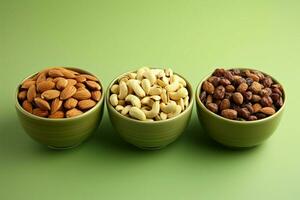 Nut trio in ceramic bowl on green backdrop, promoting healthy eating AI Generated photo