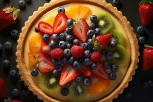 fresh fruit tart with fresh fruit on dark background photo