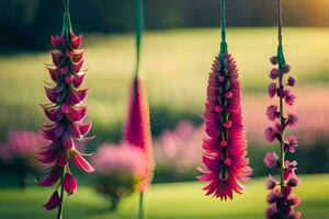 pink flowers hanging from a string in a field. AI-Generated photo