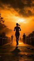 Running enthusiasts silhouette against the backdrop of a radiant sunrise Vertical Mobile Wallpaper AI Generated photo