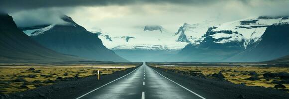 Moody Icelandic landscape An asphalt road crosses a stormy mountain backdrop AI Generated photo