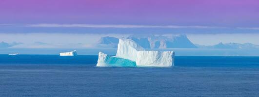 Iceberg seen from cruise ship vacation near Greenland coast in Arctic circle near Ilulissat Disko Bay photo