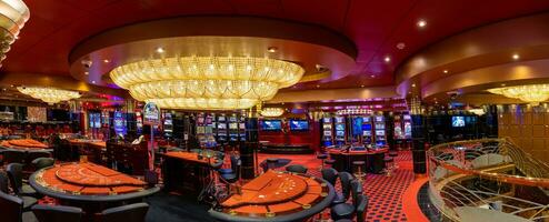 Casino gambling blackjack and slot machines waiting for gamblers and tourist to spend money photo