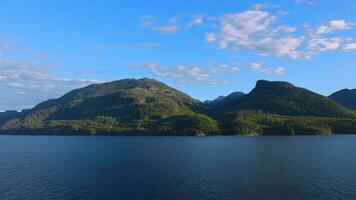 Cruise to Alaska, cruise ship sailing through scenic landscapes, mountains and lakes photo