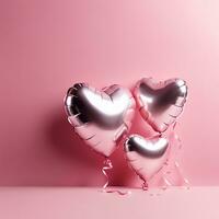 heart shaped balloons on pink background photo