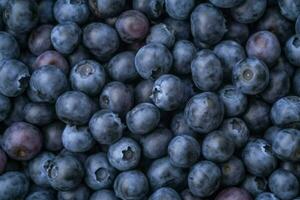 Texture of blueberry. Close up of raw organic berry fruits. Sweet and fresh background. Generative AI photo