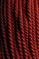 Red rope texture background. Backdrop made with ropes. Generative Ai photo