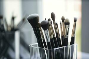 Cosmetic brushes in a glass. Professional makeup brushes set for make up artist, cosmetics, make up theme. Generative AI photo