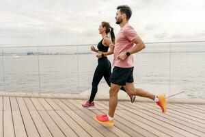 A woman and a man doing sports running. Friends run together. Fitness exercises for a healthy lifestyle. Running fast in full height in the fresh air. Sports people, training together. photo