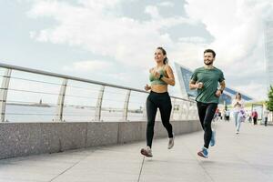 Physical education together, family couple healthy lifestyle. Trainer workout people use fitness watch and app for exercise results. A woman and a man in fitness clothes for running. photo