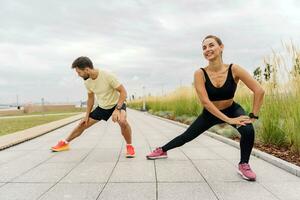 Friends are fitness people who train together. Using smart watches for fitness, sportswear and running shoes. Runners are getting ready for the race. photo