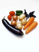 set of vegetables, eggplant, carrot, potato, onion, tomato, cucumber, basil photo