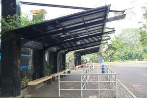 empty bus stop. midday. no vehicles photo