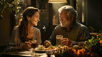 An elderly couple in love, a man and a woman, are sitting at a table, looking at each other with love and smiling photo