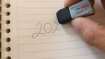 2023 to 2024 year changing concept with handwriting on notebook video