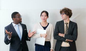 Portrait of confident business team standing in office. Multiethnic group. photo