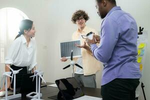 A multi-national team of architects and designers is meeting to brainstorm designs for solar cell panels for office and residential buildings photo