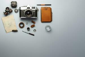 Top view of vintage camera notebook and stationery on grey background AI Generated photo