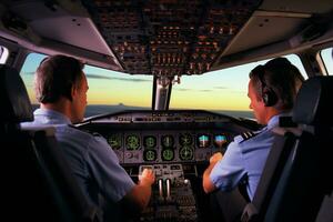 dos piloto en un cabina de un comercial aerolíneas foto