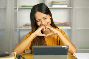 Asian woman at home happy from talking with friends photo