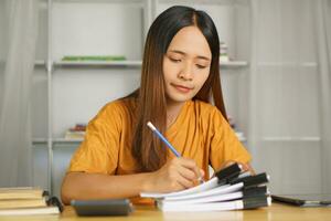 Asian women bring home work photo