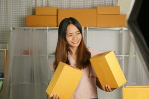 Online sellers check product boxes before delivering to customers. photo