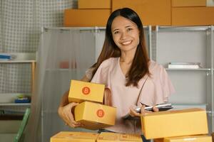 Online merchants view purchase orders via computer. to deliver products to customers photo