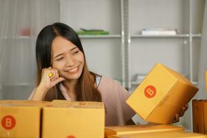 Online sellers check product boxes before delivering to customers. photo