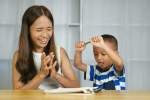 Mother and Luk are happy. Practice writing messages correctly photo