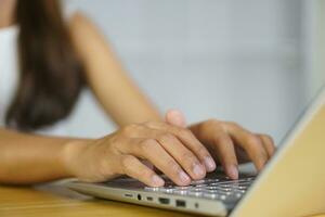 business woman working at home Contact the team using the computer. photo