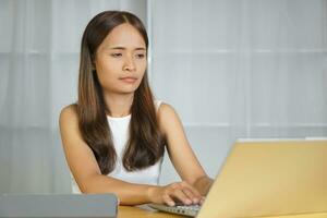 business woman working at home Contact the team using the computer. photo