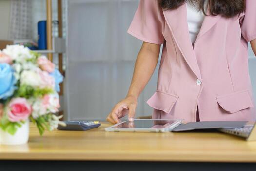 Online sellers use computers to respond to customer messages. photo