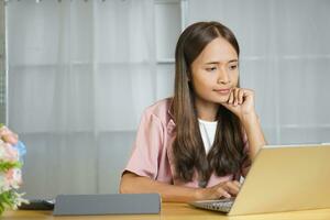 business woman working at home Frustrated by falling profits Not according to goal photo