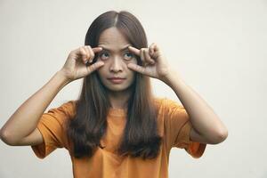 woman spreads her eyes to avoid sleepiness. photo