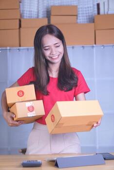 Online merchants view purchase orders via computer. to deliver products to customers photo