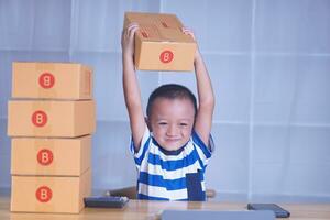 Boy training to sell products online photo