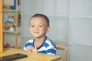 Boy sitting in the rest room at home photo