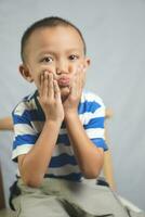 Happy boy in photo studio smile and laugh